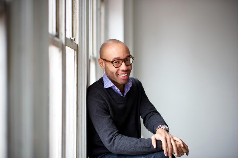 Aaron Diehl sitting next to a window