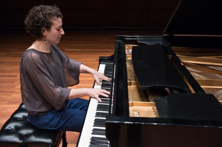 Pianist Clare Longendyke playing at the piano at the Ordway Center in Saint Paul, Minnesota