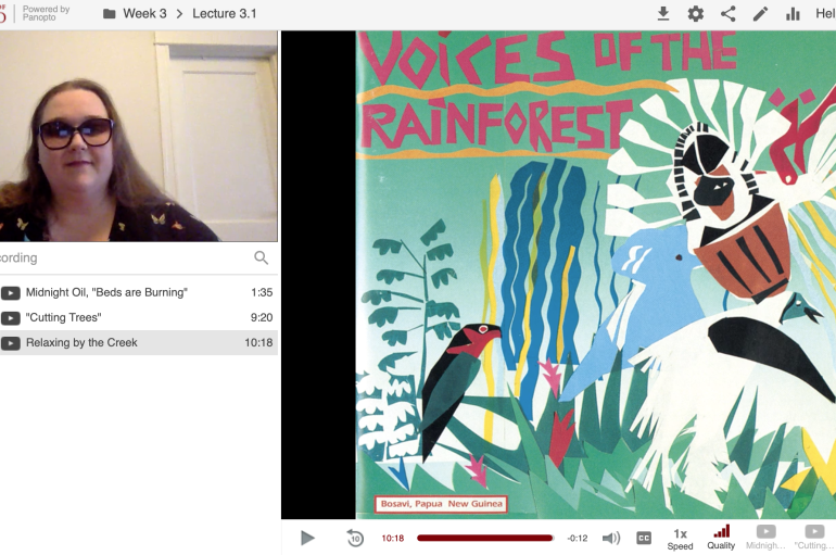 Screenshot from Ailsa Lipscombe in a Panopto recorded lecture showing her face on the top left next to an image of album art that says "Voices of the Rainforest"