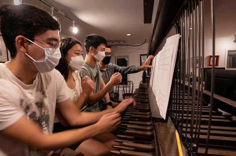 Fourth-years João Francisco Shida, Emily Kim and Joseph Min practice for the inauguration with University Carillonneur Joey Brink on the carillon in the bell tower of Rockefeller Memorial Chapel.