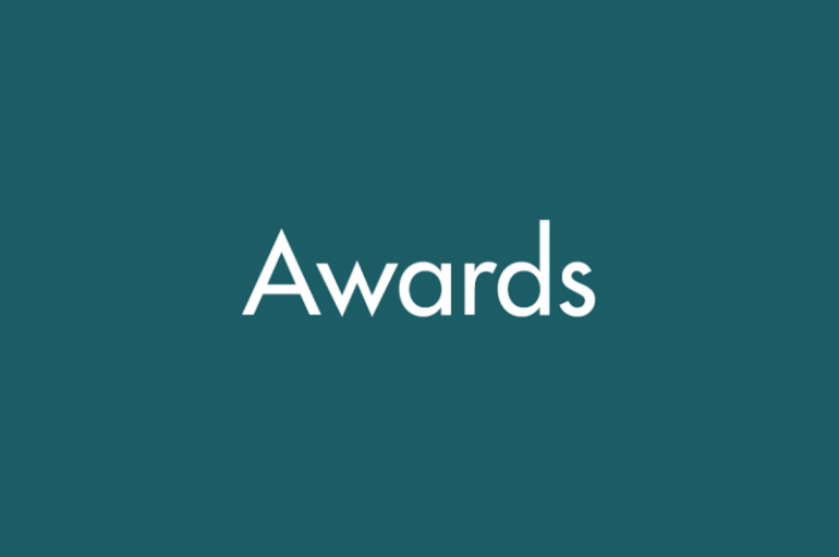 A teal background with the word "Awards"