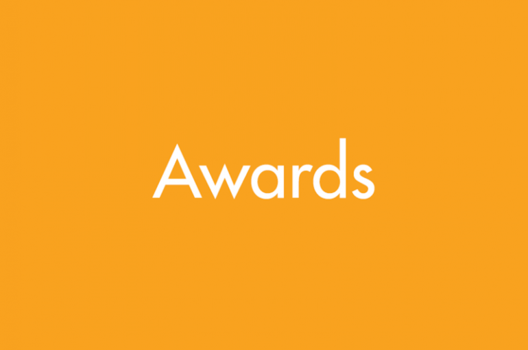 Graphic with a yellow background and white text reading "awards"