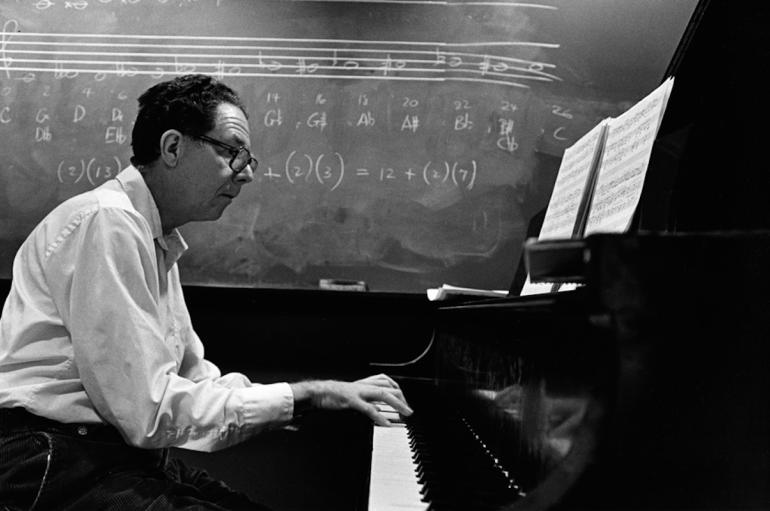 Easley Blackwood sitting at a piano