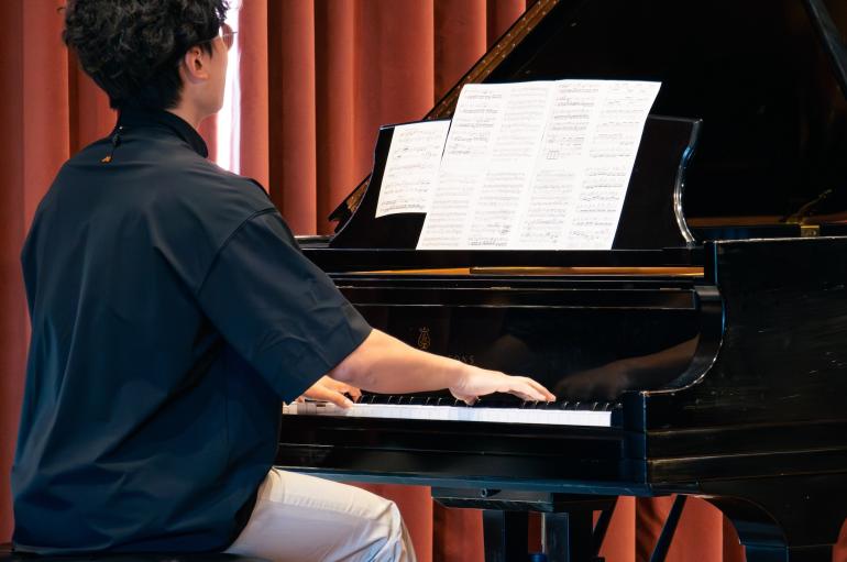 Student playing piano