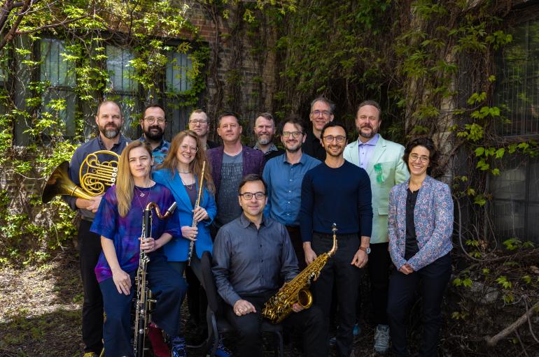 The Grossman Ensemble poses among foliage.