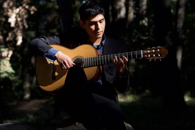 Juan Rivera playing the guitar