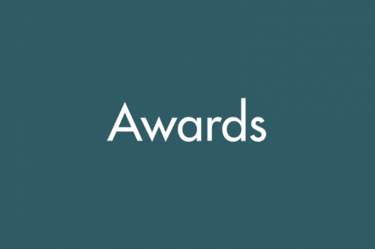 Teal background with text reading "Awards"