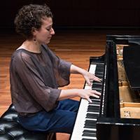 Clare Longendyke performing at the piano