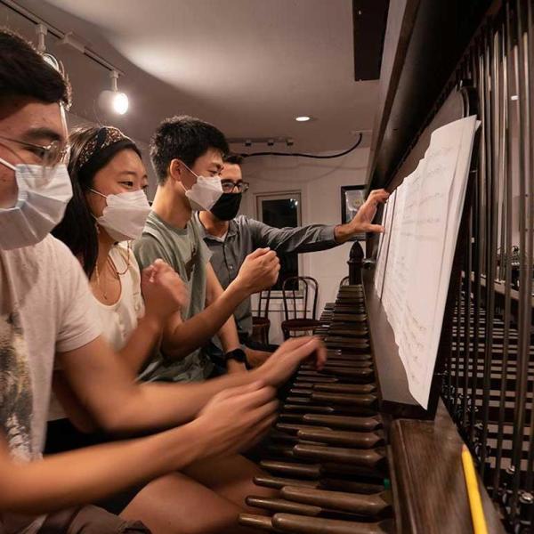 Fourth-years João Francisco Shida, Emily Kim and Joseph Min practice for the inauguration with University Carillonneur Joey Brink on the carillon in the bell tower of Rockefeller Memorial Chapel.