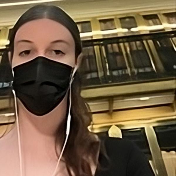 Eva Pensis headshot wearing mask for Covid safety