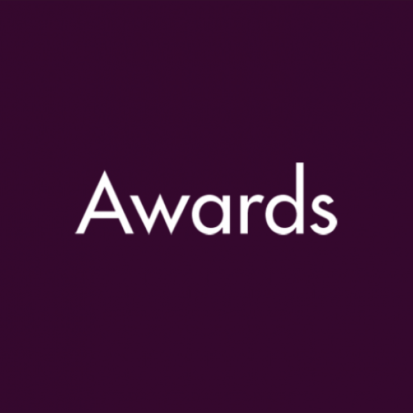 Dark purple background with white text that says "Awards"