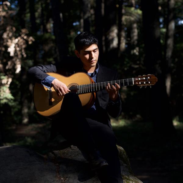 Juan Rivera playing the guitar