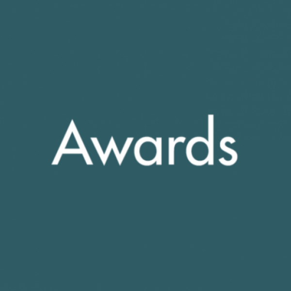 Teal background with text reading "Awards"