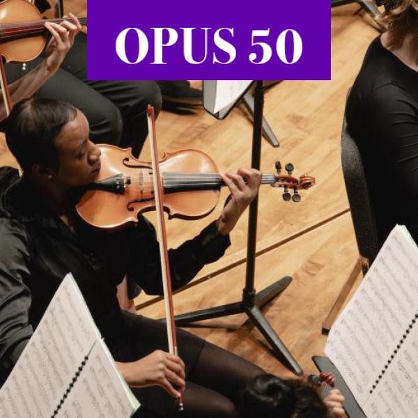 USO Member on stage with violin